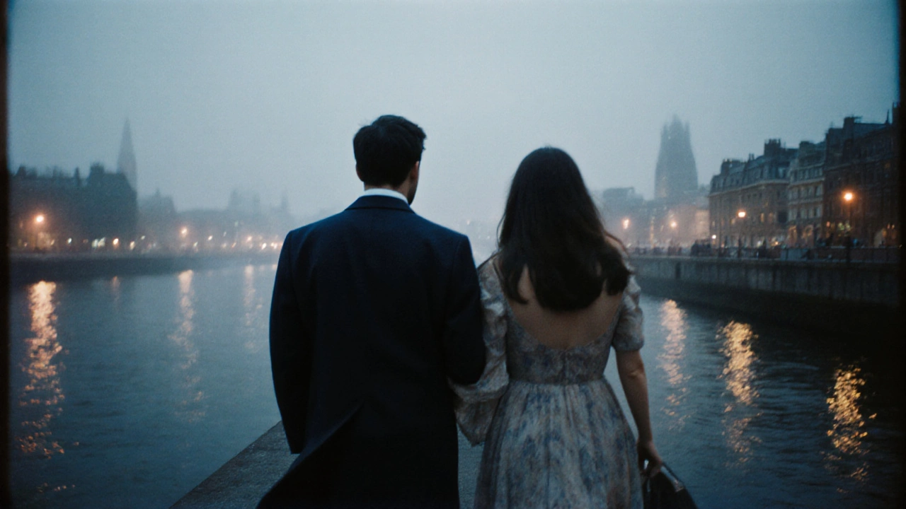 Two people walking along the Thames at dusk, backs turned, no faces visible.