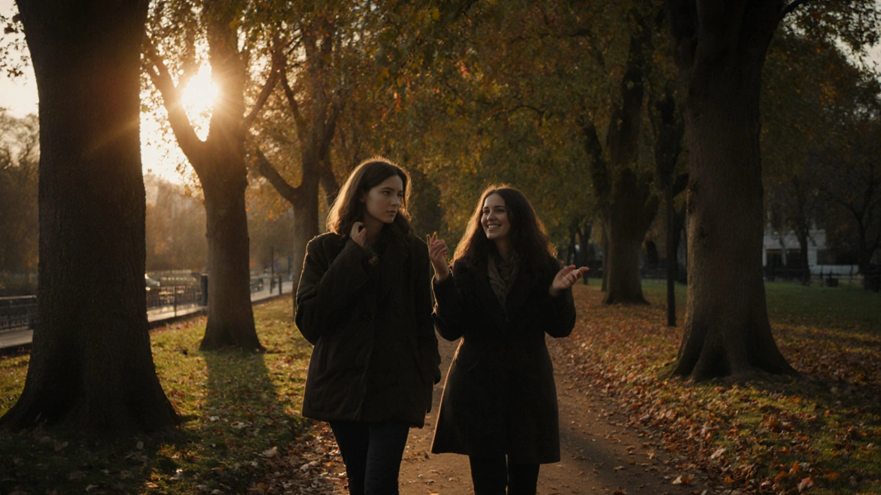 Two people walking calmly in Kensington Gardens, sharing a peaceful moment.