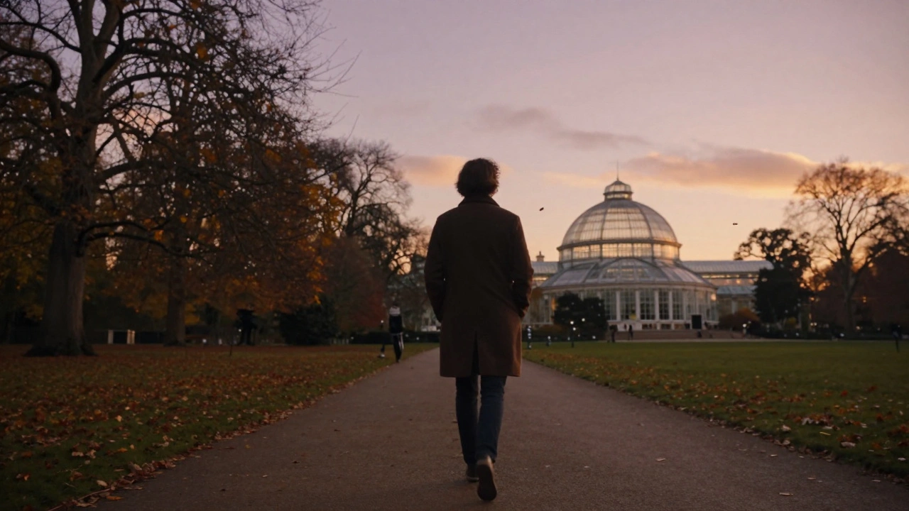 A person walking peacefully through Crystal Palace Park at sunset.