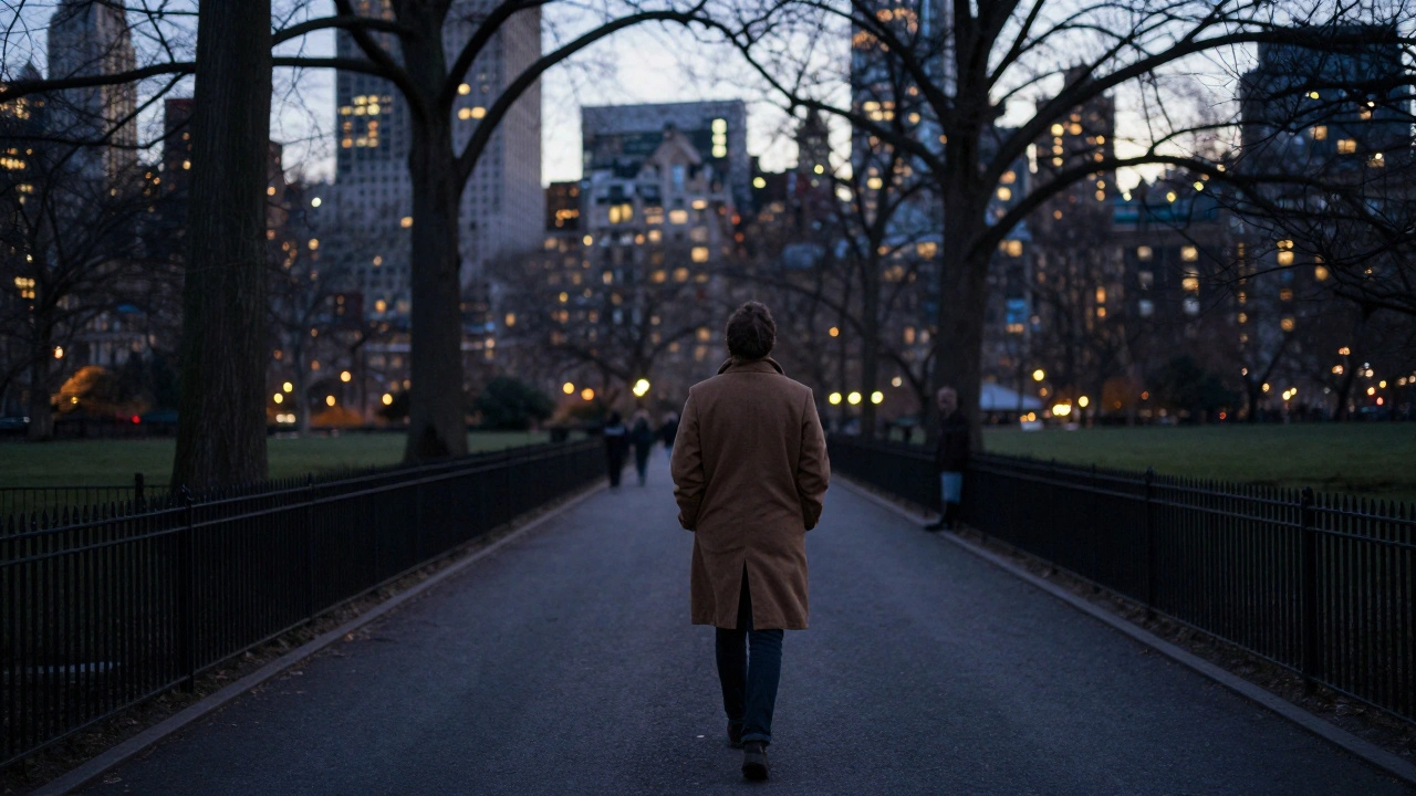 A person walking alone through Hyde Park at dusk, surrounded by city lights.