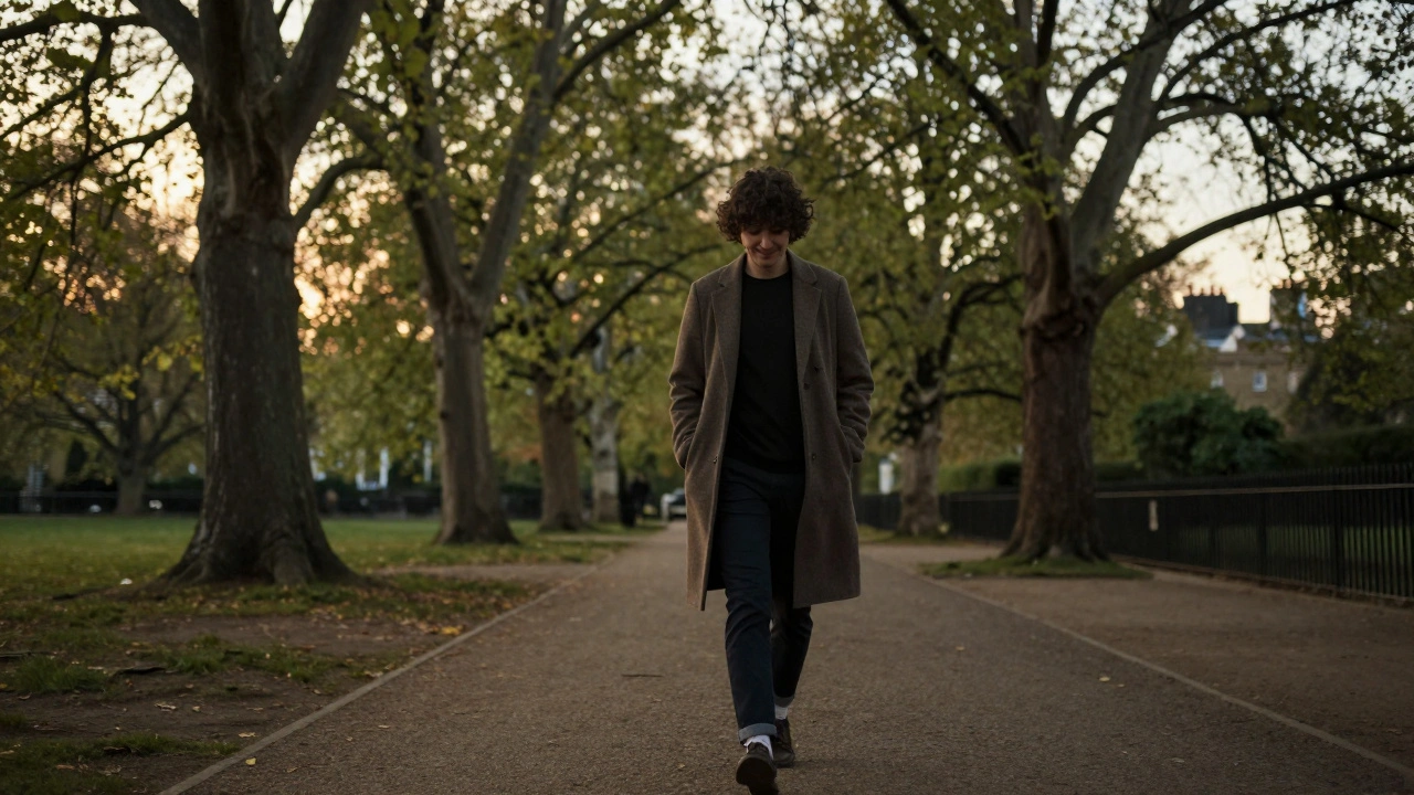A person walking peacefully through a North London park at dusk, dressed casually, enjoying the quiet moment.